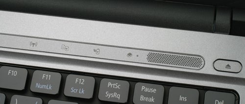 Close-up of Acer Aspire Timeline 4810T-353 laptop keyboard and speaker.