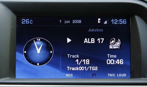 Citroen C5 Tourer's infotainment system display showing clock and music track.