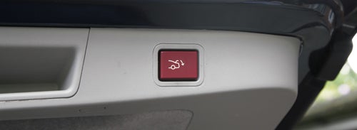 Close-up of Citroen C5 tailgate electronic lift button.