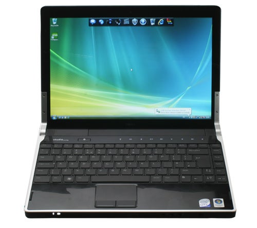 Dell Studio XPS M1340 laptop with screen displaying desktop.