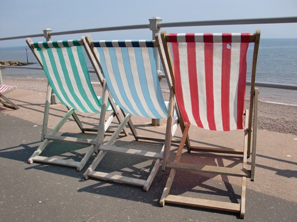 Striped deck chairs by the seaside.