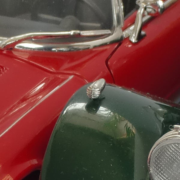 Close-up of vintage toy cars with focus on red car