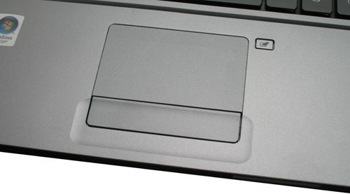 Close-up of Acer Aspire 5810T laptop's touchpad and keyboard.