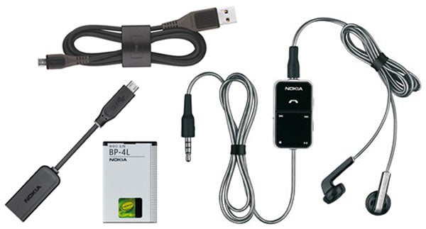 Nokia N97 accessories including cables, battery, and headset.