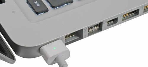 MagSafe power connector plugged into a 2009 MacBook Pro.