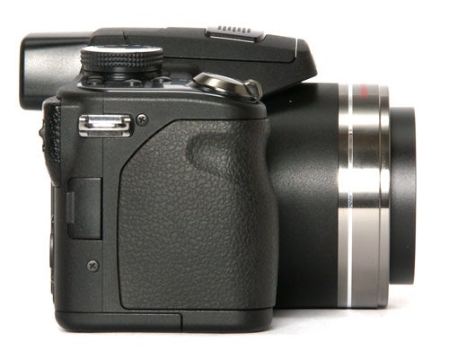 Close-up of a digital camera on a white background