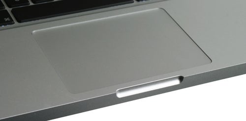Close-up of 2009 MacBook Pro trackpad and keyboard area.
