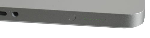 Close-up of 2009 MacBook Pro showing battery indicator lights.