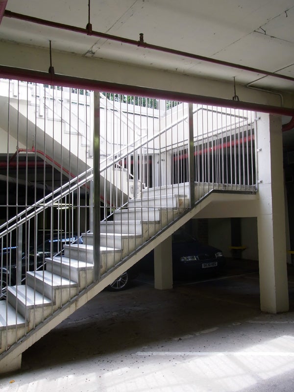 Photo taken with Ricoh CX1 showing a staircase in a parking garage.