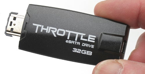 Hand holding OCZ Throttle eSATA Flash Drive, 32GB.