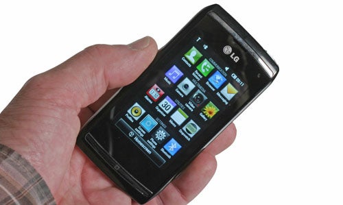 Hand holding an LG GC900 Viewty Smart smartphone.