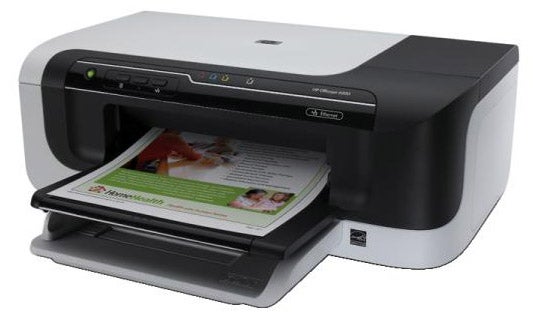 HP OfficeJet 6000 printer with paper in output tray.