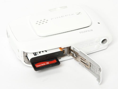 Fujifilm FinePix Z30 camera with open memory card slot.