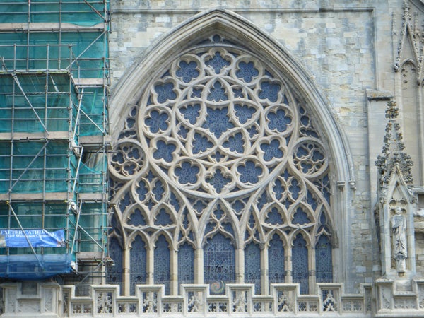 Detailed shot of intricate church window architecture.