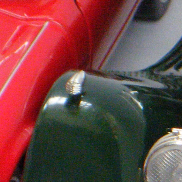 Close-up of a red and green object with details.