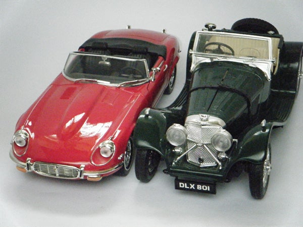 Photo of two vintage model cars.