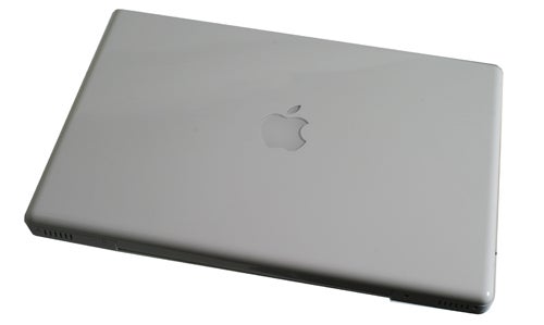 Apple MacBook 13-inch White closed lid on white background.