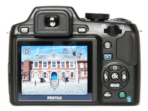 Pentax X70 Digital Camera with a preview of a building on LCD.