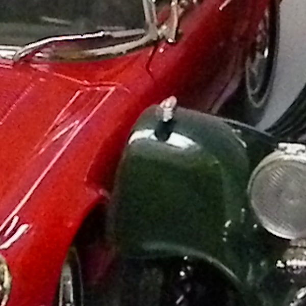 Close-up of vintage red and green cars