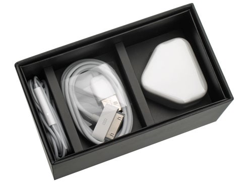 Apple iPhone 3GS box with accessories including charger and cable.
