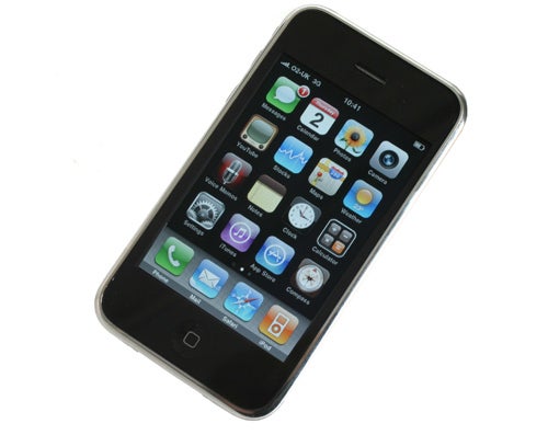 Apple iPhone 3GS displaying colorful app icons on screen.