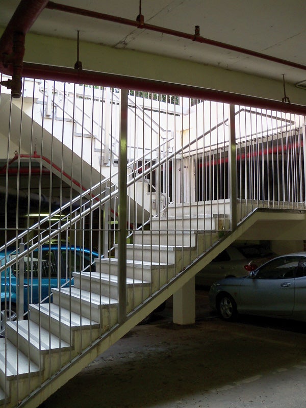 Photo taken with Kodak EasyShare Z915 displaying staircase and parking area.
