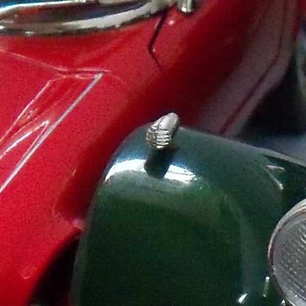 Close-up of vintage red and green toy cars