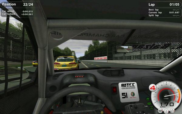 First-person view from a racing simulation game cockpit.