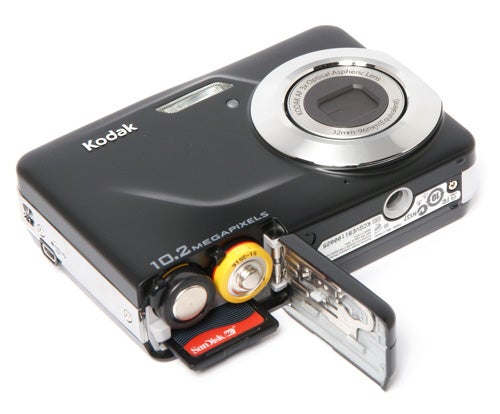 Kodak EasyShare C180 camera with open battery compartment.