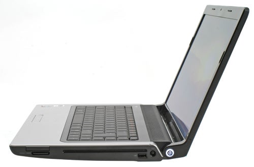 Dell Studio 1555 laptop with screen open on white background.