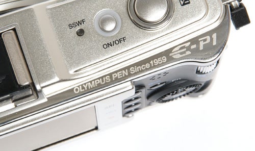 Close-up of Olympus Pen E-P1 camera body and controls.
