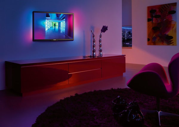 Philips LCD TV displaying colorful image in a modern room.