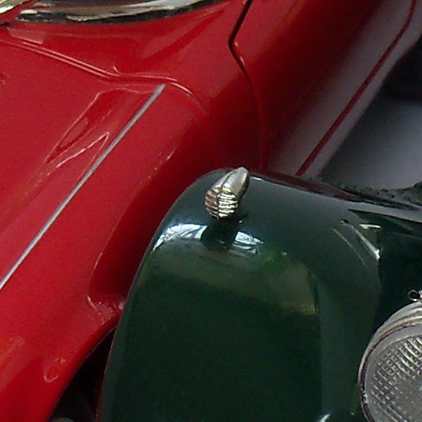 Close-up of a red and green toy motorcycle