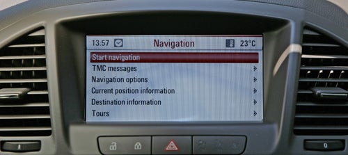 Vauxhall Insignia's navigation system display on dashboard.Vauxhall Insignia Elite navigation screen displaying map and temperature.