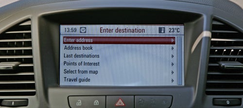 Vauxhall Insignia Elite's navigation system showing a map and directions.Vauxhall Insignia Elite Nav system interface displaying menu options.