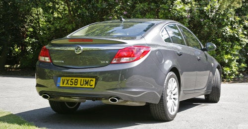 Rear view of a grey Vauxhall Insignia Elite Nav on driveway