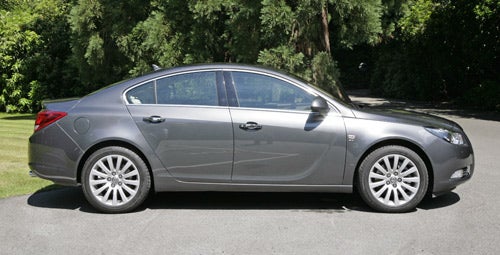 Side view of a parked grey Vauxhall Insignia Elite Nav.