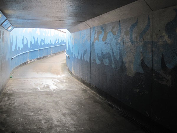 Photo of a graffiti-covered tunnel captured by Canon IXUS 990 IS.