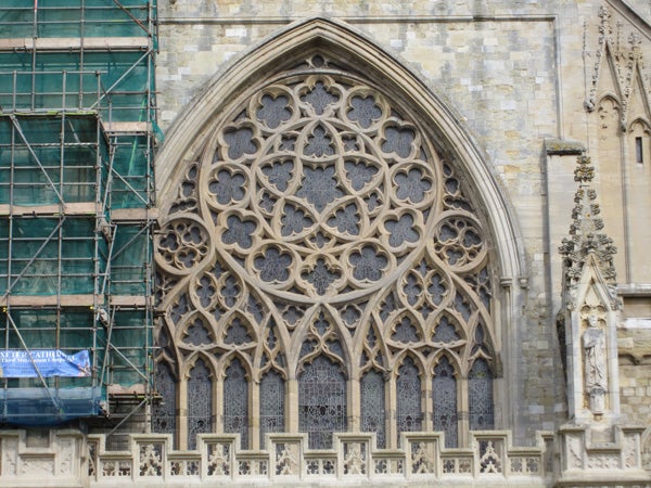 Detailed architecture of a cathedral's window facade.