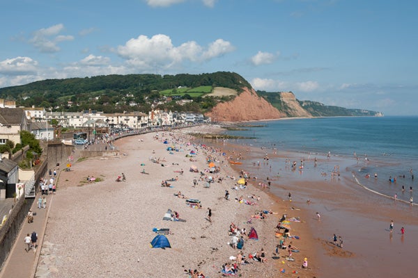 Crowded beach landscape shot with Nikon D3x camera.