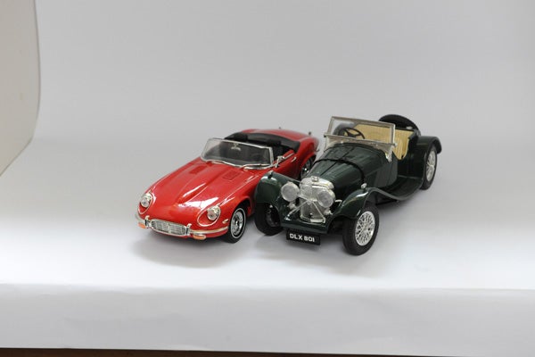 Two model cars photographed on a white background.