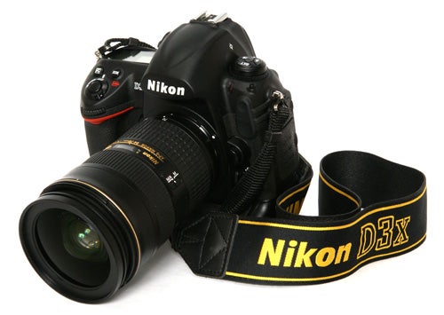 Nikon D3x DSLR camera with lens and strap displayed.