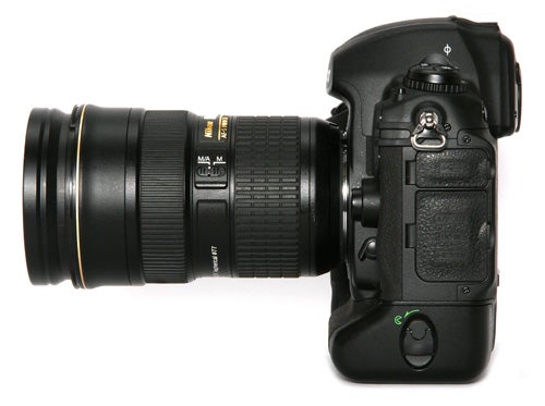 Nikon D3x DSLR camera with telephoto lens.
