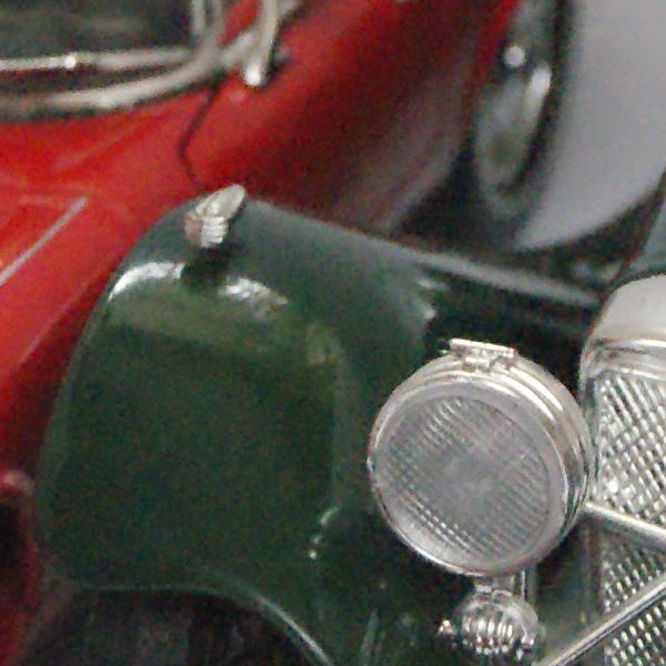 Close-up of vintage toy cars showcasing camera's depth of field.