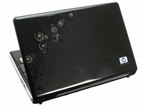 HP Pavilion dv6-1240ea laptop with patterned black lid.