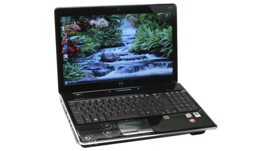 HP Pavilion dv6-1240ea laptop with nature wallpaper on screen.