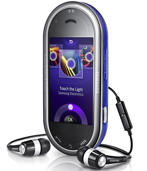 Samsung M7600 Beat DJ mobile phone with earbuds.