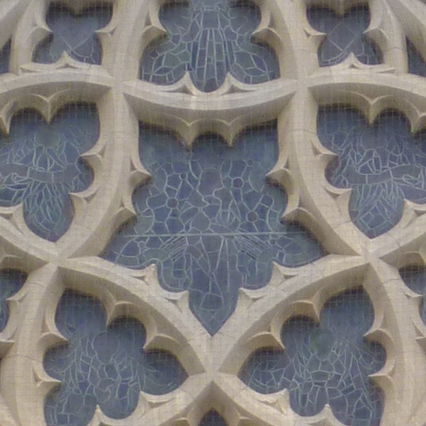 Close-up of intricate stone carving patterns on a wall.