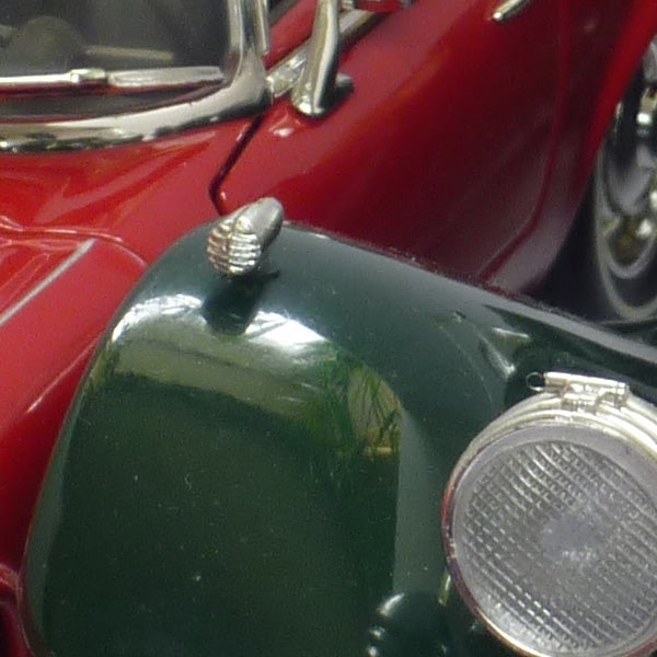 Close-up of green vintage car detail captured with Panasonic Lumix DMC-FX60.