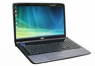 Acer Aspire 7535G laptop with screen displaying desktop wallpaper.